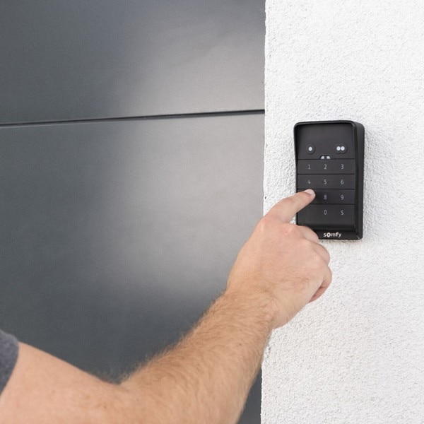 somfy-hand-typping-keypad-garage-door