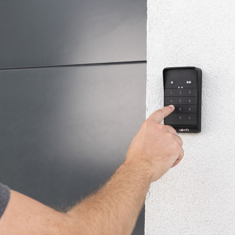 somfy-hand-typping-keypad-garage-door